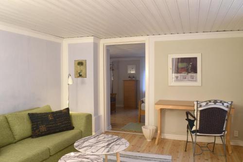a living room with a couch and a table at Villa Luna Breakfast Hotel in Killeberg