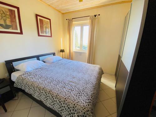 Postel nebo postele na pokoji v ubytování Marasusa - Il Giardino sul Mare