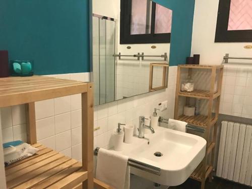 a bathroom with a white sink and a mirror at Venetian Experience in Venice