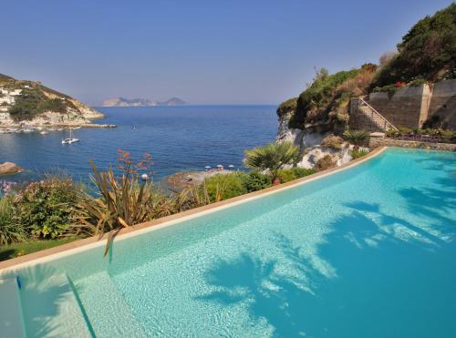 a swimming pool with a view of the ocean at Maridea - La Caletta - Luxury Villa in Ponza