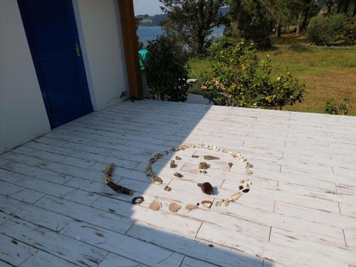 a heart made out of shells on a patio at Villa in Le Faou with Panoramic Sea Views in Hanvec