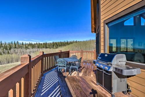 a grill on a deck with a table and chairs at Silverheels Ranch with Game Room, Near Breck! in Fairplay