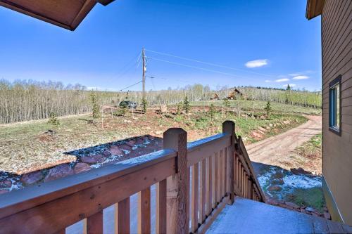 a balcony of a house with a view of a road at Silverheels Ranch with Game Room, Near Breck! in Fairplay