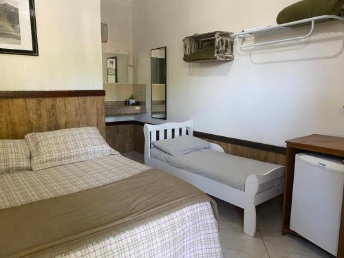 Una cama o camas en una habitación de Hotel Fazenda Chiminelli