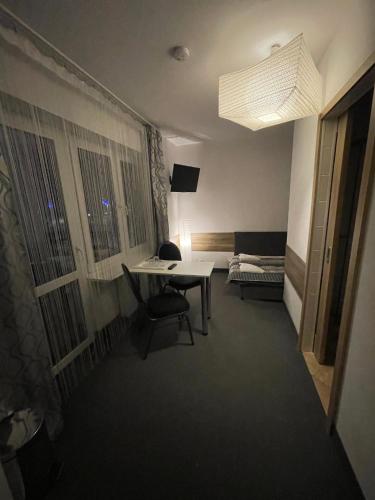 a room with a desk and a bed in a room at Antonina ***PensjonPrzyKortach*** in Szczawno-Zdrój