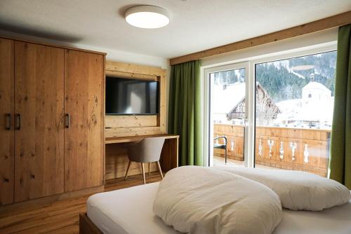 Posteľ alebo postele v izbe v ubytovaní Appartement Pension Strolz