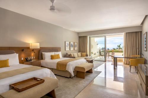 Postel nebo postele na pokoji v ubytování Grand Velas Riviera Maya - All Inclusive
