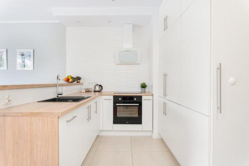 Kuchyň nebo kuchyňský kout v ubytování Dream4You Apartments