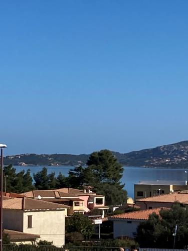 a group of buildings and a body of water at Aqualife luxury home 4 in Arzachena