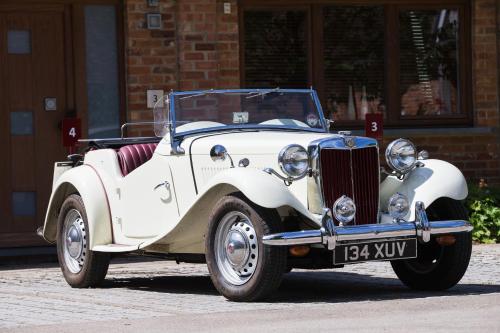 an old white car parked on a street at Ashbrook Lets Apartments in Blewbury