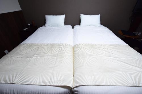 Ένα ή περισσότερα κρεβάτια σε δωμάτιο στο Land-Residential Hotel Fukuoka - Vacation STAY 81863v