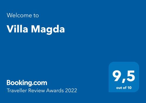 a blue sign with the text welcome to villa magaza at Villa Magda in Berehove