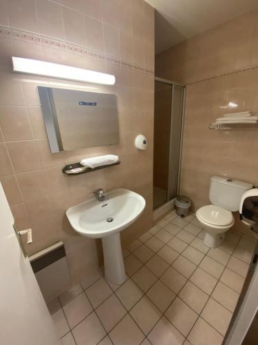 a bathroom with a sink and a toilet at Domaine L'Efferves'Sens in Chavanod