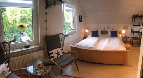 a bedroom with a large bed and a window at Holiday home Groß Kordshagen/Ostsee 2774 in Flemendorf