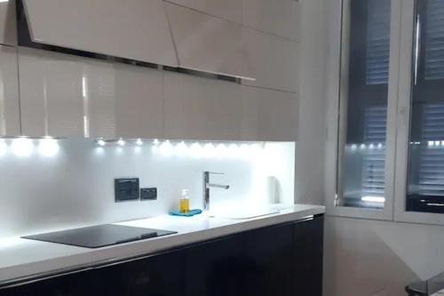 a kitchen with a sink and a counter top at Nr65 Valletta Portview Apartment in Valletta