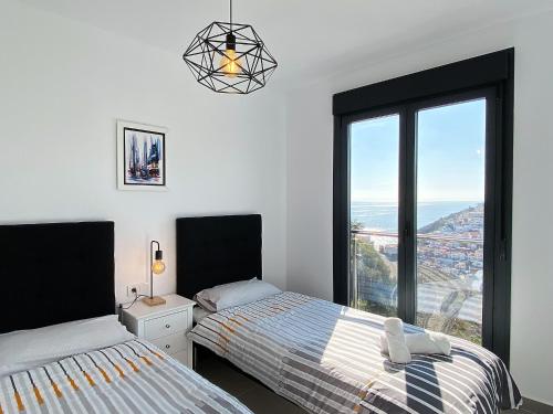 Кровать или кровати в номере Penthouse Balcon del Mar 124 Casasol