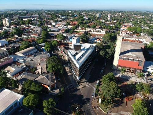 an overhead view of a city with buildings and trees at Hotel Itália in Paranavaí