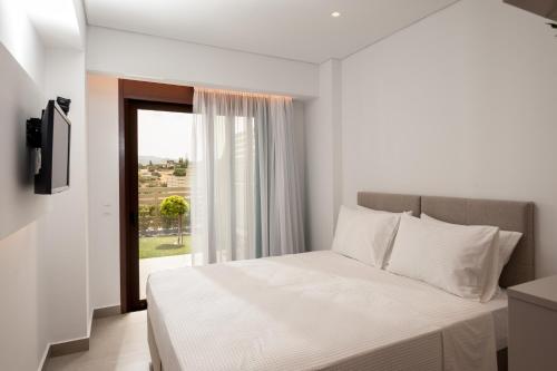 Tempat tidur dalam kamar di Thyme Sea View Apartments