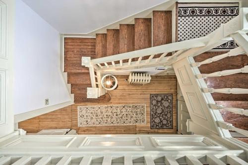 a staircase in a room with wooden walls at Spacious Getaway 7 Mi to Whitetail Slopes! in Mercersburg