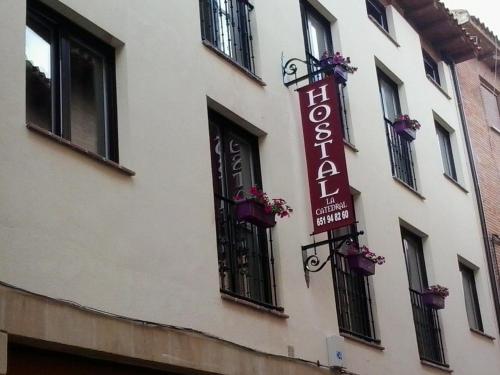 a hotel sign on the side of a building at Hostal la Catedral in Santo Domingo de la Calzada