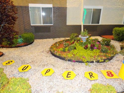 a model of a garden with letters and flowers at Super 8 by Wyndham South Boston VA in South Boston