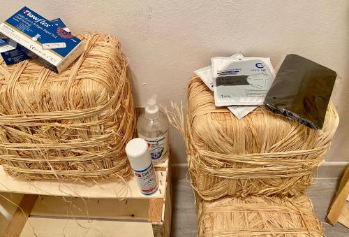a laptop computer sitting on top of a wicker chair at LA PIAZZETTA in Comacchio
