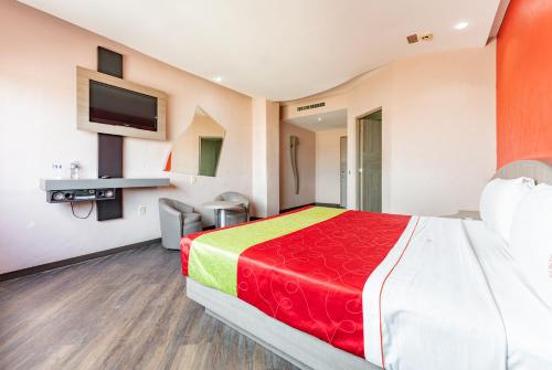 Ένα ή περισσότερα κρεβάτια σε δωμάτιο στο Hotel y Villas Vento
