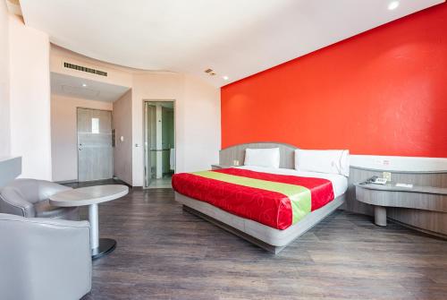 Ένα ή περισσότερα κρεβάτια σε δωμάτιο στο Hotel y Villas Vento