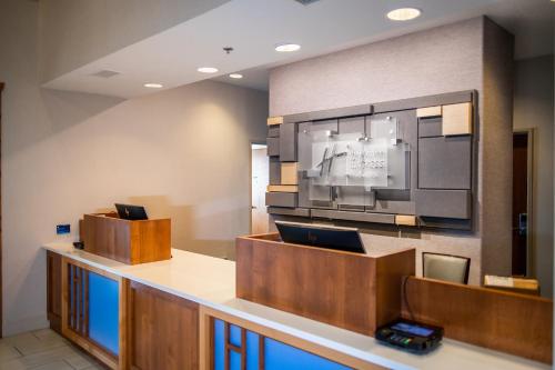 a large room with a large screen tv at Holiday Inn Express & Suites Custer-Mt Rushmore in Custer