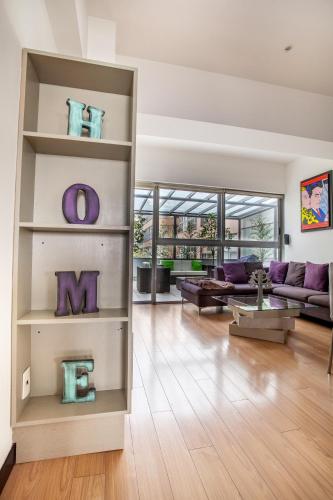a living room with a couch and a table at Beautiful apartment in Polanco area with amenities in Mexico City