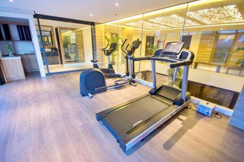 a gym with two exercise bikes in a room at Commander Suites de Boracay in Boracay