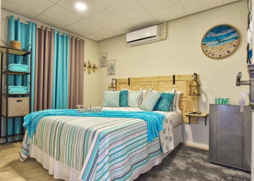 Voodi või voodid majutusasutuse Turquoise B&B toas