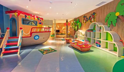 a childrens play room with a slide and a train at InterContinental Bali Sanur Resort, an IHG Hotel in Sanur