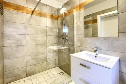 a bathroom with a sink and a mirror at Apartment in Rogowo near Baltic Sea Beach in Rogowo