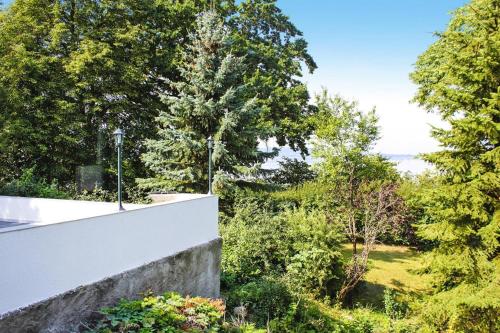 a view from the balcony of a house with trees at Reihenhaus Seeblick, Sommersdorf in Sommersdorf