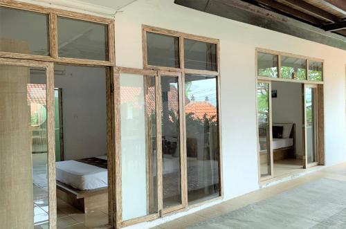 Postel nebo postele na pokoji v ubytování Chendana Homestay Bali