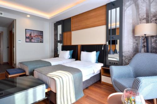 Postel nebo postele na pokoji v ubytování Expoist Hotel