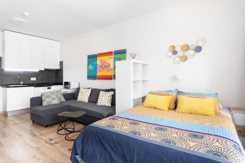 A bed or beds in a room at Home2Book Sea View Studio Puerto de la Cruz