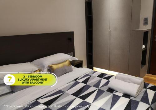 Ένα ή περισσότερα κρεβάτια σε δωμάτιο στο 7Stonez Suites Geo38 Genting Highlands
