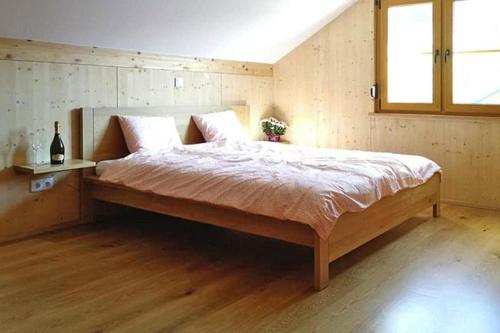 a bedroom with a large bed with a window at Holiday resort Altaussee, Lichtersberg in Lichtersberg