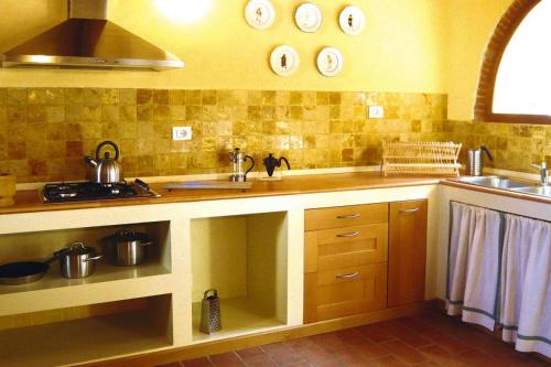 a kitchen with a sink and a counter top at Rustic House in Tuscany with Shared Pool in Ripafratta