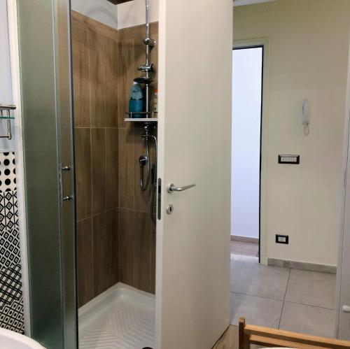 a shower with a glass door in a bathroom at Terramia in Ragusa