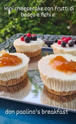 three cakes on a tray with fruit on top at Tenuta Don Paolino in Avola