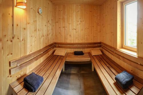a sauna with two benches and a window at Bergchalet Falkenstein, Inzell in Inzell