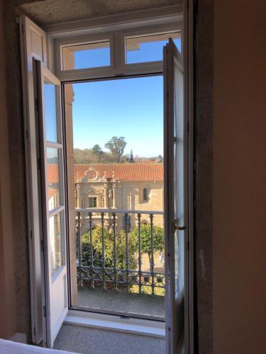 an open window with a view of a building at Hotel Montes in Santiago de Compostela