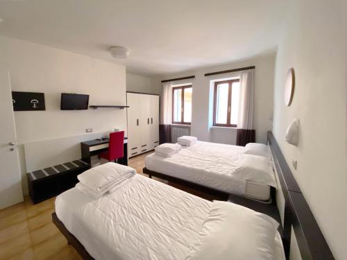 Кровать или кровати в номере Hotel Alla Torre
