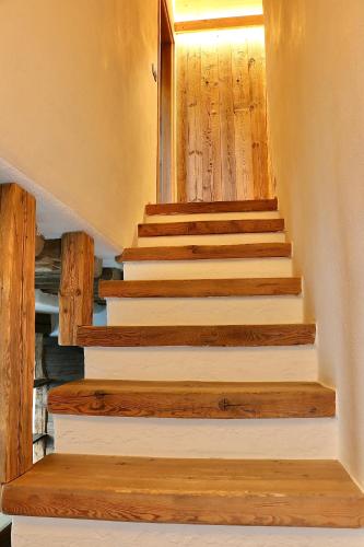 a stairway in a house with wooden stairs at Appartamenti Diva in Livigno