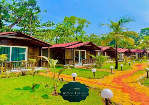 een resort met een pad naar een huis bij Coco Teros Resort in Mandrem