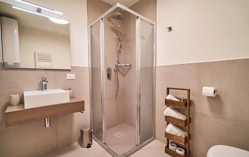 a bathroom with a shower and a sink at Residenza SubitoSanto - Appartamento 4A "Mantegna" in Padova