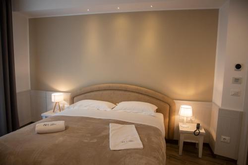 Ένα ή περισσότερα κρεβάτια σε δωμάτιο στο Hotel Adriatico